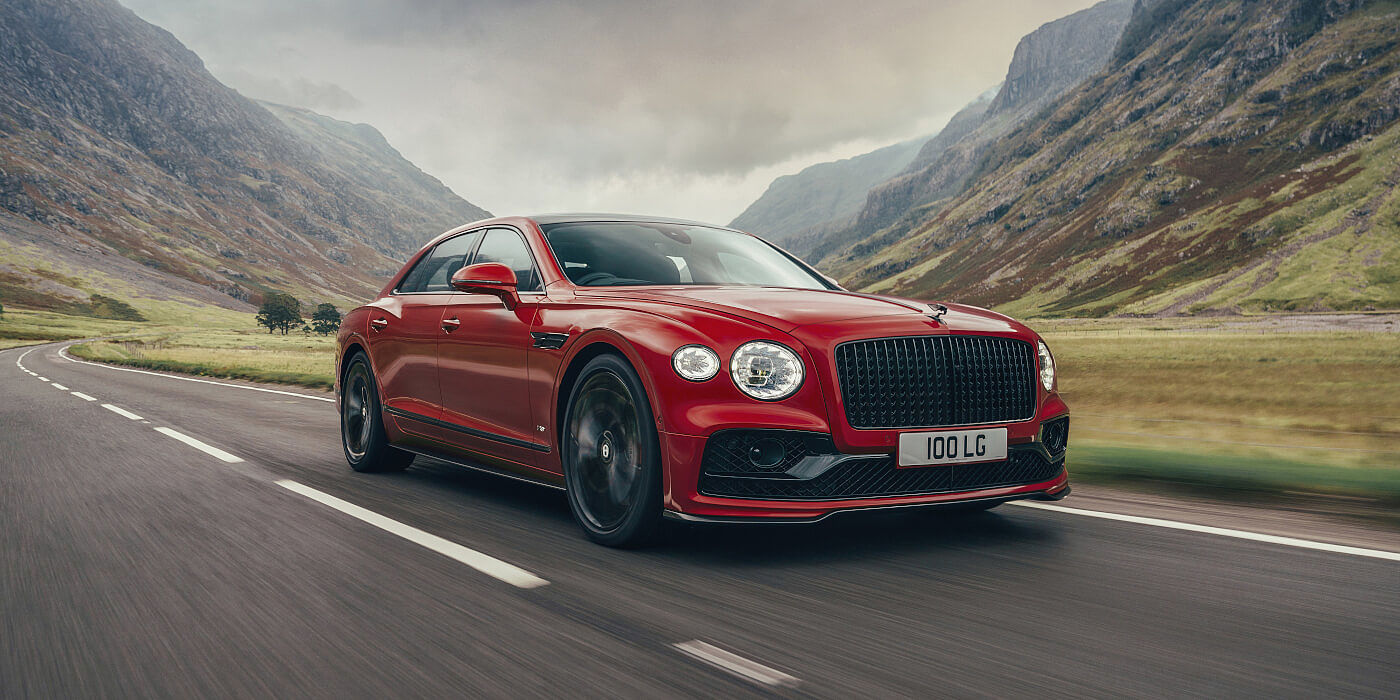 new-Bentley-Flying-Spur-V8-in-Dragon-Red-2-paint-colour-front-three-quarters-and-Blackline-specification-Glen-Coe-Scotland
