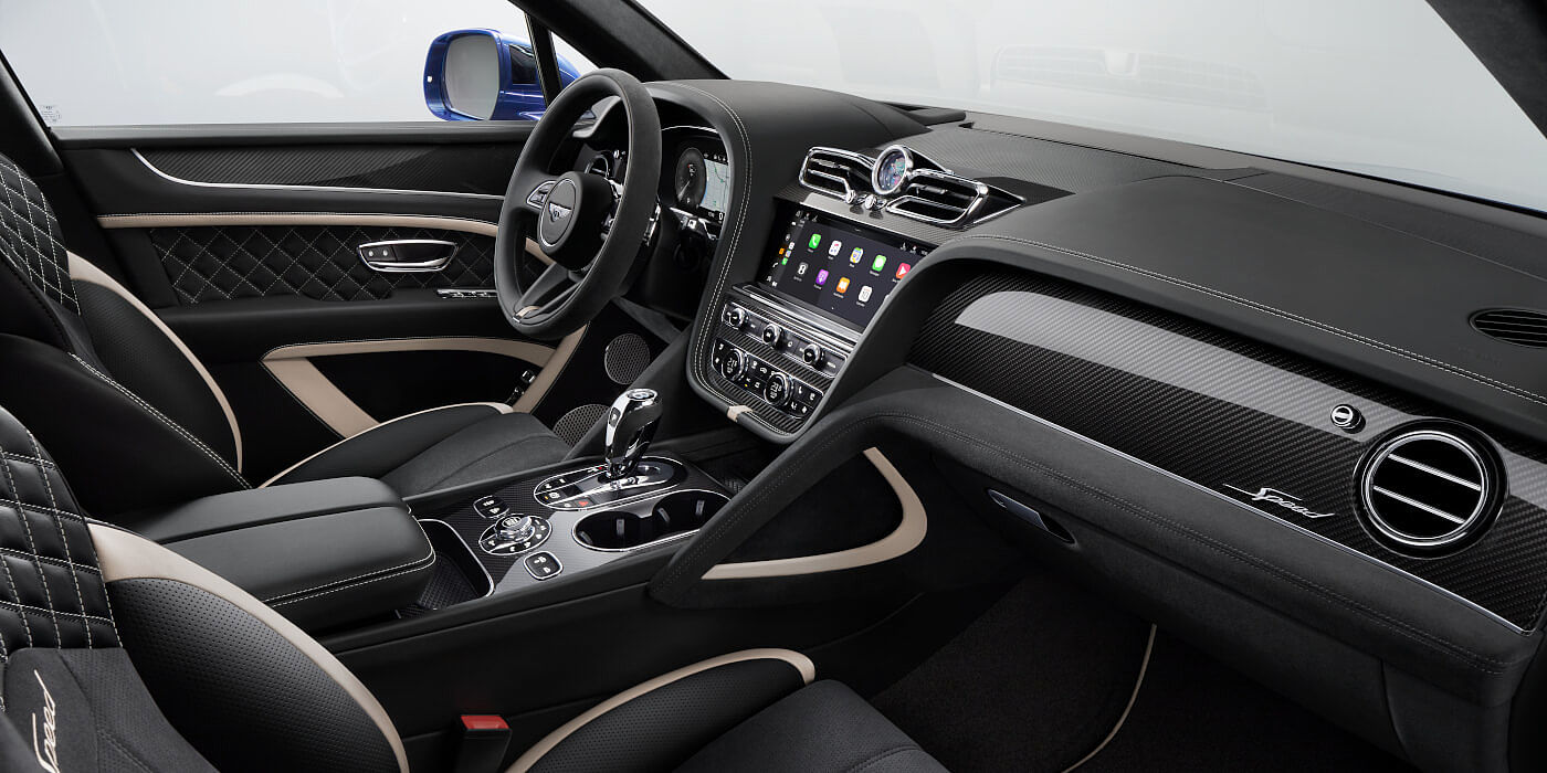 Bentley Johannesburg Bentley Bentayga Speed SUV front interior in Beluga black and Linen hide with carbon fibre veneer