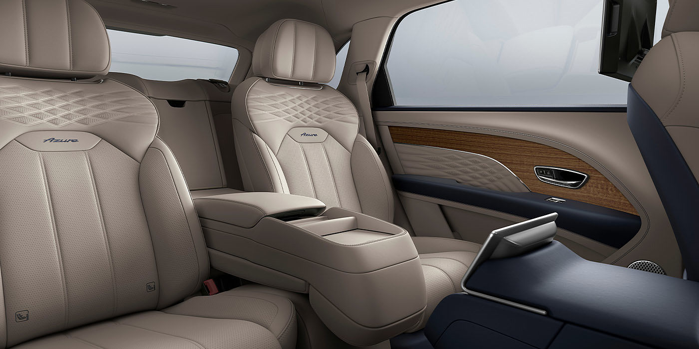 Bentley Johannesburg Bentley Bentayga EWB Azure interior view for rear passengers with Portland hide featuring Azure Emblem in Imperial Blue contrast stitch.