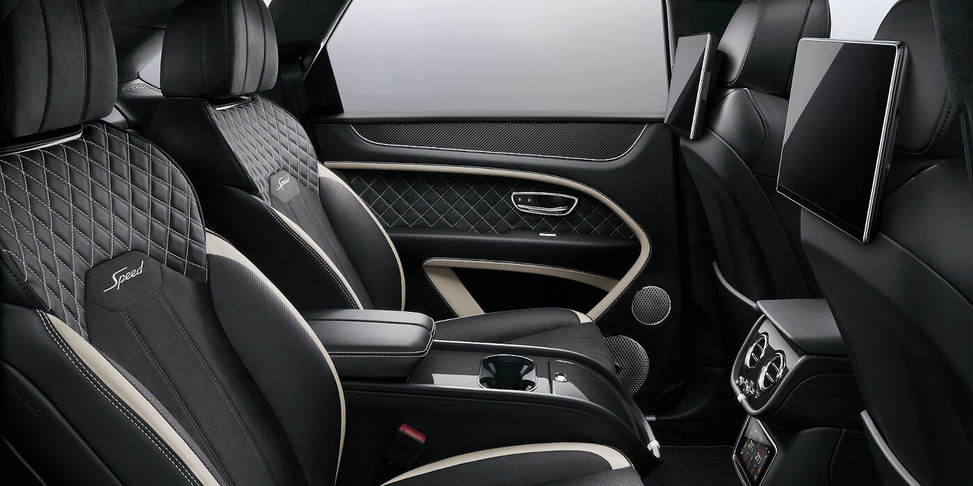 Bentley Johannesburg Bentley Bentayga Speed SUV rear interior in Beluga black and Linen hide with carbon fibre veneer