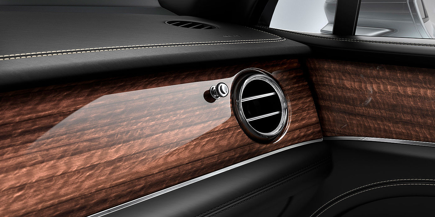 Bentley Johannesburg Bentley Bentayga front interior Crown Cut Walnut veneer and chrome air vent.