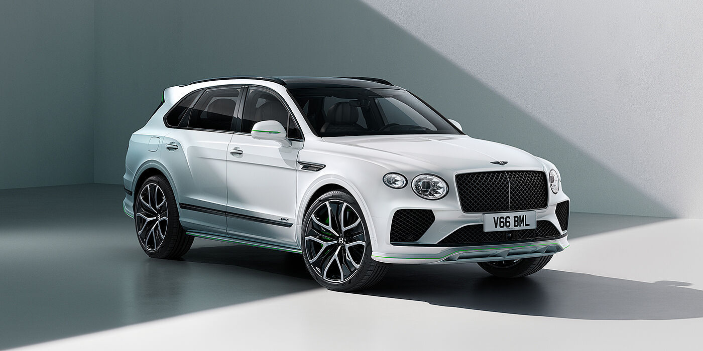 Bentley Johannesburg Bentley Bentayga Speed SUV front three quarter in Snow Quartz Pearlescent by Mulliner white paint against a grey wall