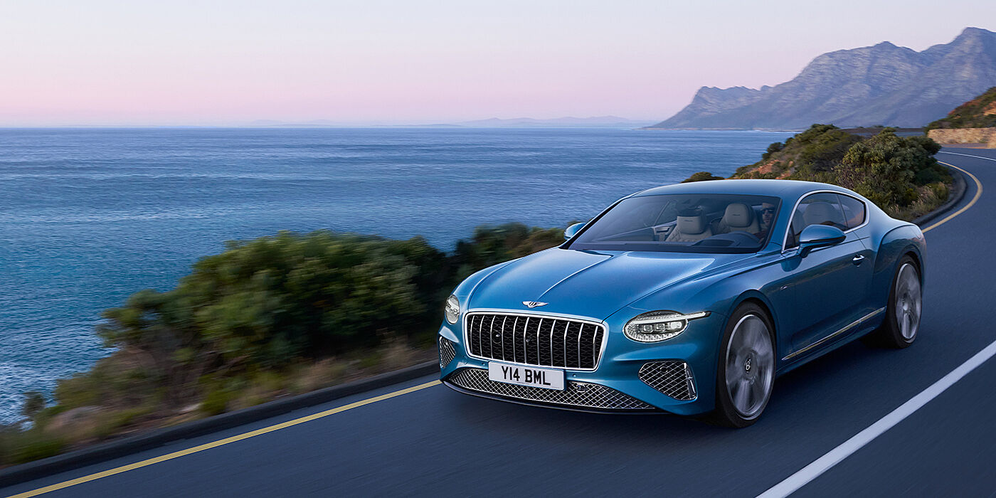 Bentley Johannesburg New Bentley Continental GT Azure coupe in Light Windsor blue paint with 22 inch Azure wheels and chrome grill, driving dynamically by the se
