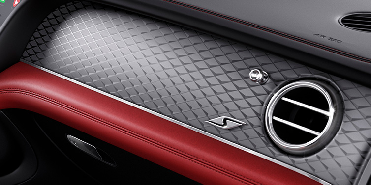 Bentley Johannesburg Bentley Bentayga S SUV front interior dash with Dark Tint Diamond Brushed Aluminium veneer and S badge surrounded by Hotspur red and Beluga black hide