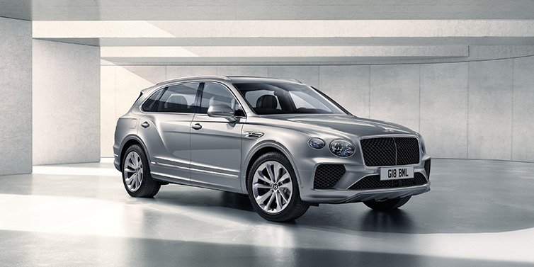 Bentley Johannesburg Bentley Bentayga Extended Wheelbase SUV front three quarter in Moonbeam paint with a grey background