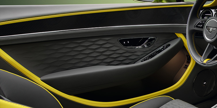 Bentley Johannesburg Bentley Continental GTC Speed convertible interior door details featuring Gravity Grey and Cyber Yellow by Mulliner hides and high gloss carbon fibre veneer