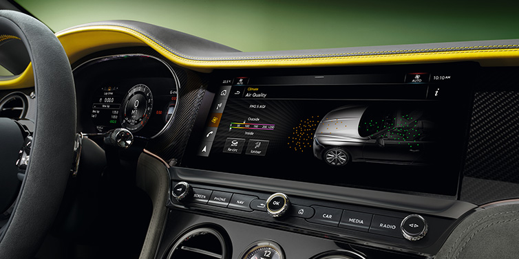 Bentley Johannesburg Bentley Continental GTC Speed convertible front interior centre console with MMI screen showing Air Quality visualisation surrounded by Cyber Yellow by Mulliner and Gravity Grey hides and high gloss carbon fibre veneer